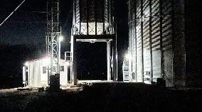 Agricultural facility at night with its yard and area lighting switched on